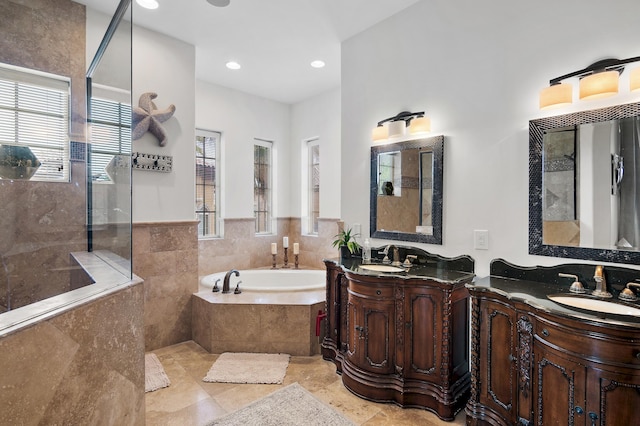 bathroom featuring vanity and plus walk in shower