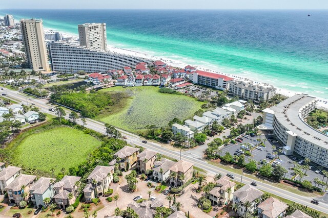 aerial view with a water view and a view of the beach