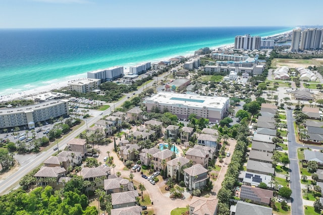 drone / aerial view featuring a water view and a beach view