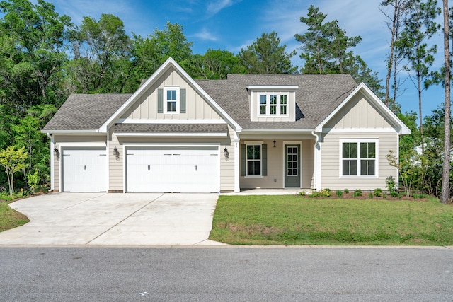 craftsman inspired home featuring a garage, a porch, and a front yard