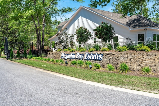 23 S J Hunters Way Lot 63, Freeport, FL 32439 - view of property exterior with roof with shingles