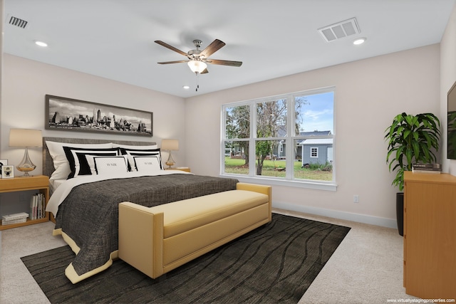 bedroom with ceiling fan and carpet flooring