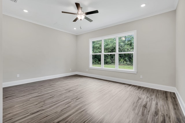 spare room with ornamental molding, ceiling fan, and hardwood / wood-style floors