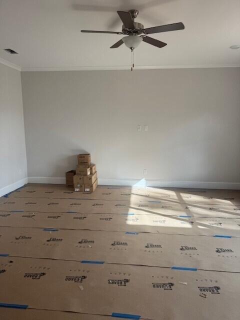 empty room featuring ornamental molding