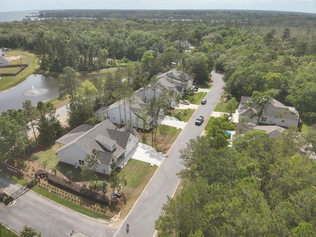 23 S J Hunters Way Lot 63, Freeport, FL 32439 - aerial view of property and surrounding area featuring a heavily wooded area, a large body of water, and nearby suburban area