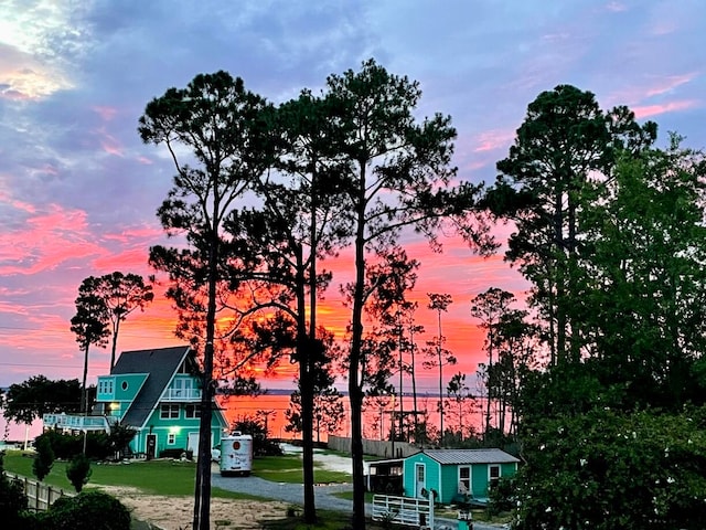 view of outdoor building at dusk