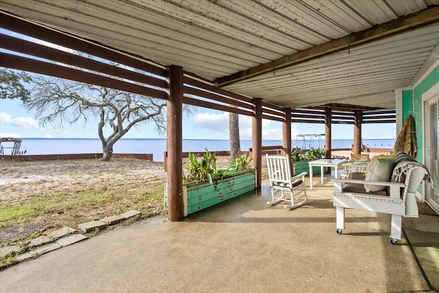 view of patio featuring a water view