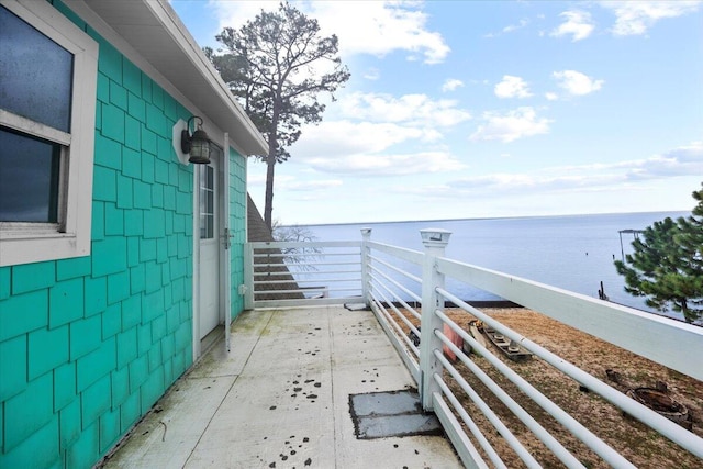 exterior space with a balcony and a water view