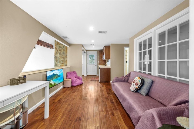 living room with dark hardwood / wood-style floors