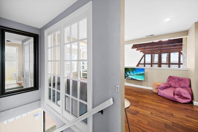 entryway with hardwood / wood-style flooring and plenty of natural light