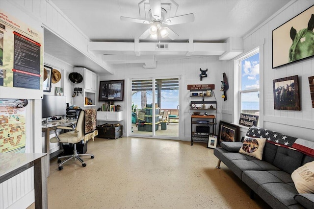 office area featuring beamed ceiling, a wealth of natural light, and ceiling fan