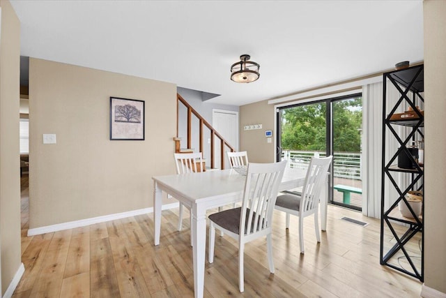 dining room with light wood-type flooring