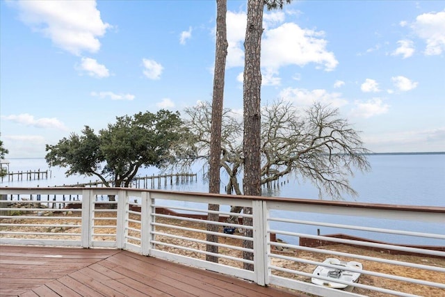 wooden terrace with a water view