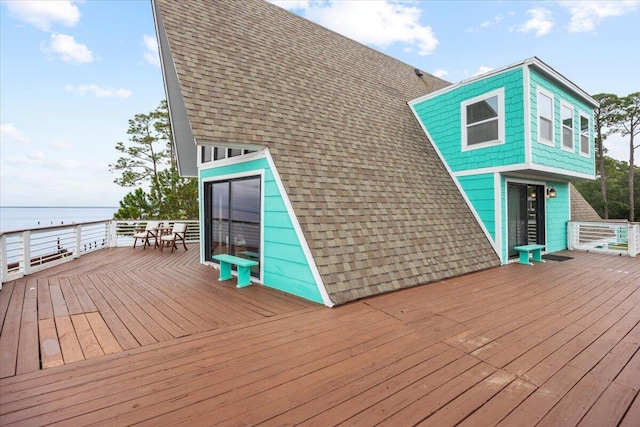 wooden terrace with a water view