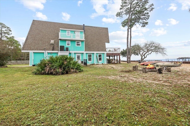 rear view of house with a lawn