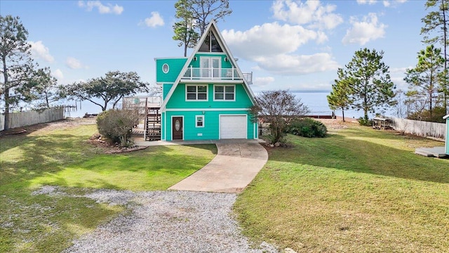 view of front facade with a garage and a front yard