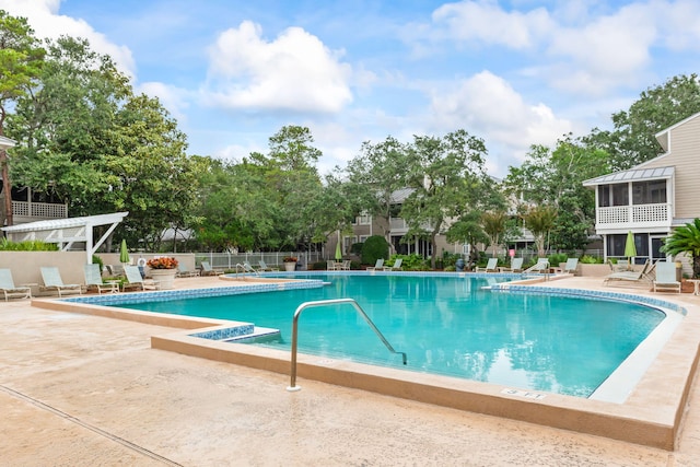 view of swimming pool with a patio