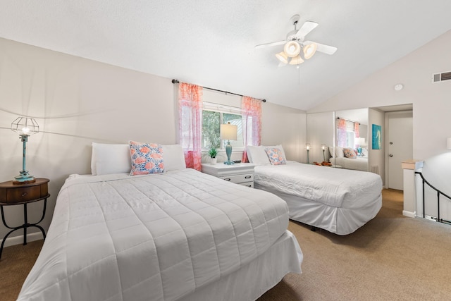 carpeted bedroom featuring ceiling fan and vaulted ceiling