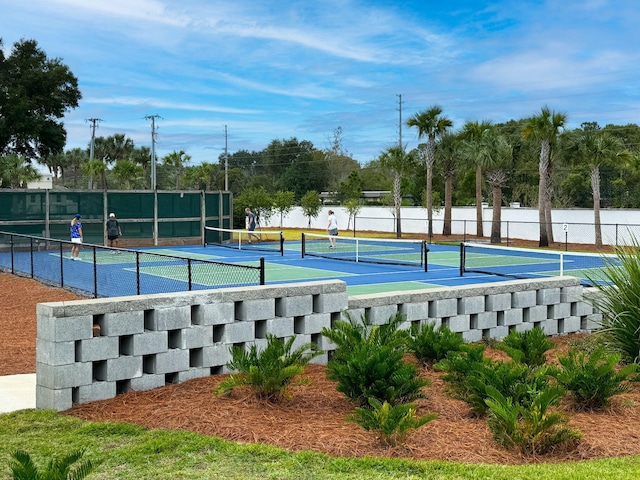 view of sport court featuring a water view