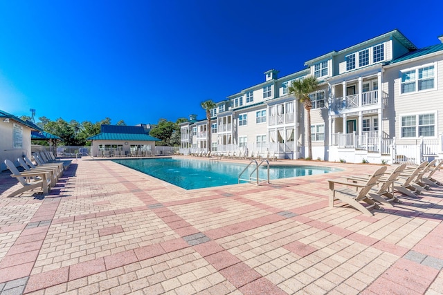 view of pool featuring a patio area