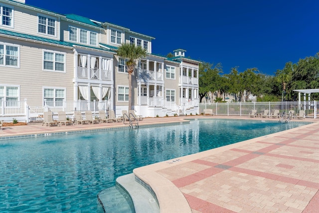 view of swimming pool featuring a patio area