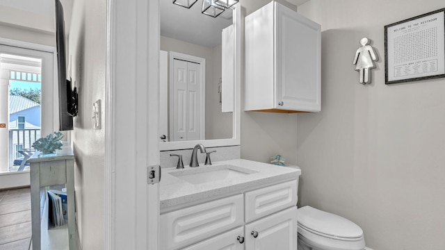 bathroom with tile patterned floors, vanity, and toilet