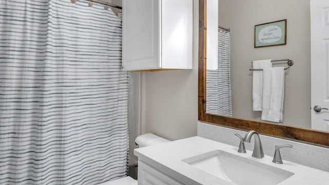 bathroom with vanity and toilet