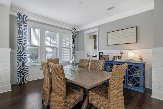 dining space with dark hardwood / wood-style flooring