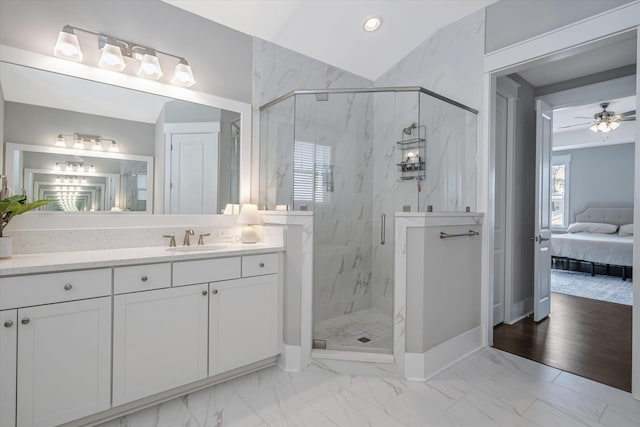 bathroom featuring vanity, ceiling fan, and walk in shower