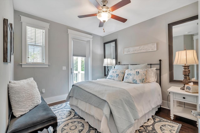 bedroom with dark wood-type flooring, access to outside, and ceiling fan