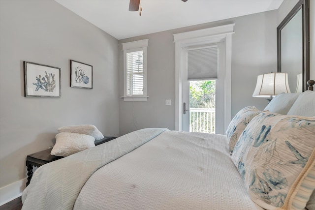 bedroom with access to exterior and ceiling fan