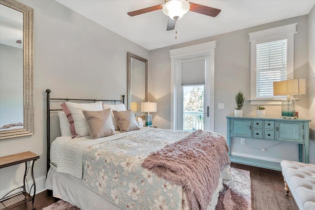 bedroom with ceiling fan, access to outside, and dark hardwood / wood-style flooring