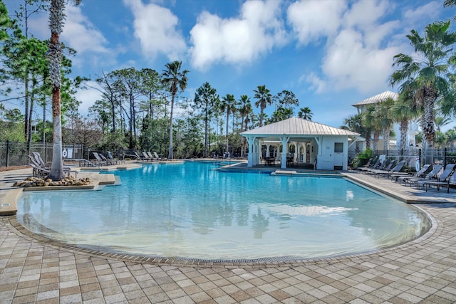 view of swimming pool with a patio