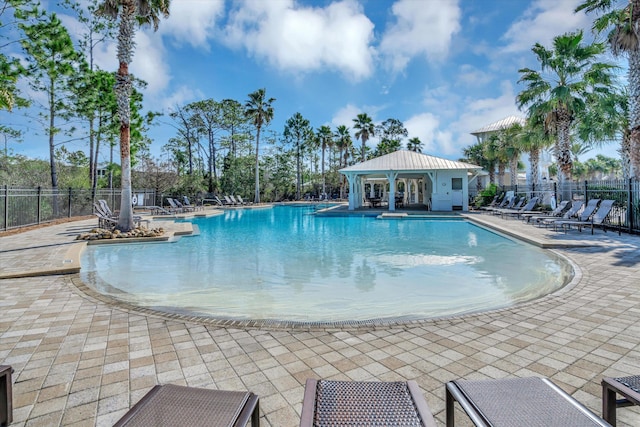 view of swimming pool with a patio