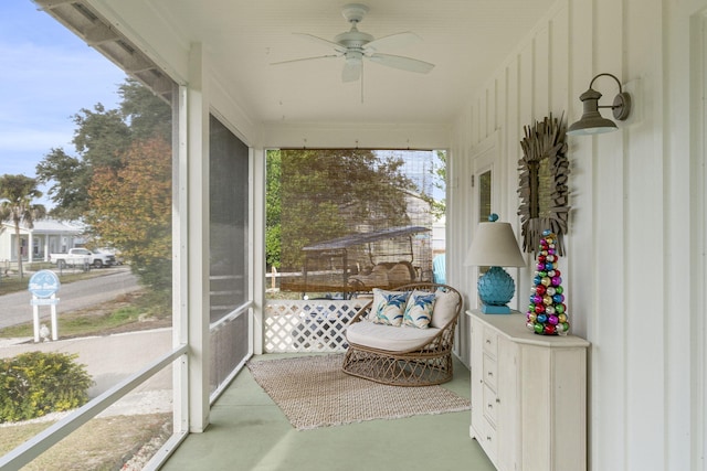 unfurnished sunroom featuring plenty of natural light and ceiling fan