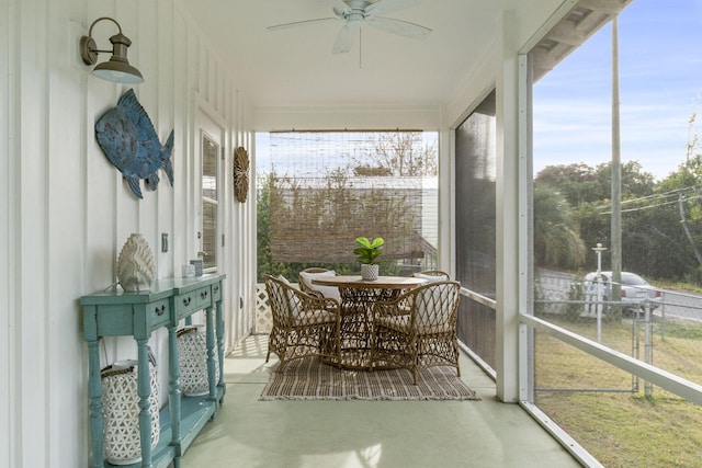 sunroom with ceiling fan and plenty of natural light