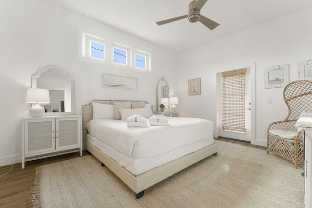 bedroom featuring ceiling fan, access to outside, and light hardwood / wood-style flooring