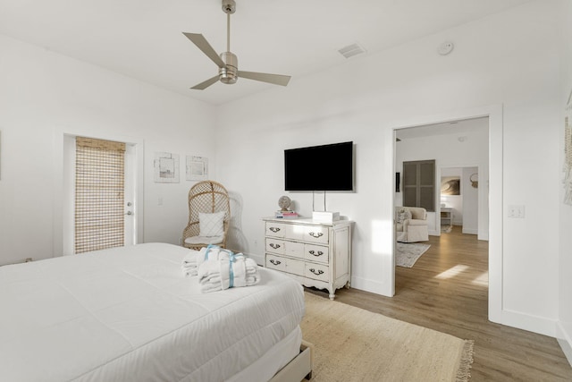 bedroom featuring hardwood / wood-style flooring and ceiling fan