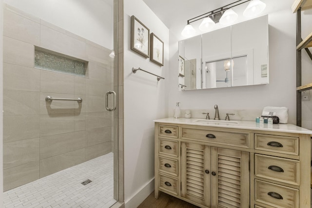 bathroom with vanity and an enclosed shower