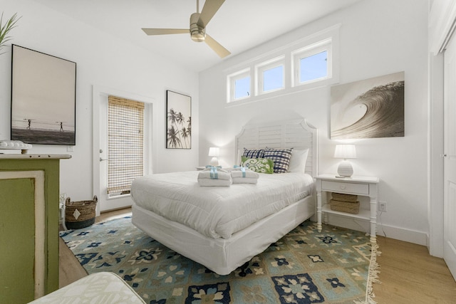 bedroom with hardwood / wood-style flooring and ceiling fan