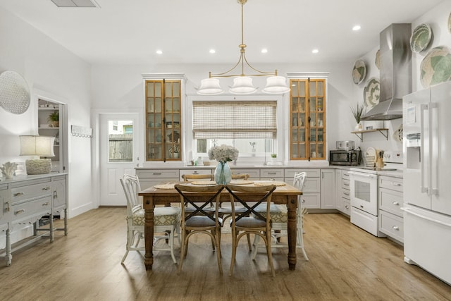 dining space featuring light hardwood / wood-style flooring