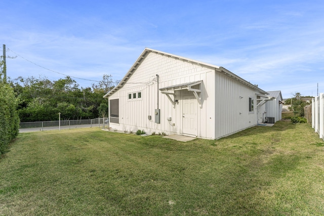 exterior space featuring a yard and central air condition unit