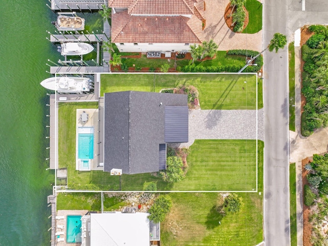 birds eye view of property with a water view