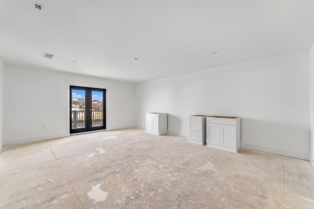 empty room featuring french doors