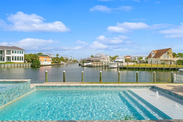 view of swimming pool with a water view