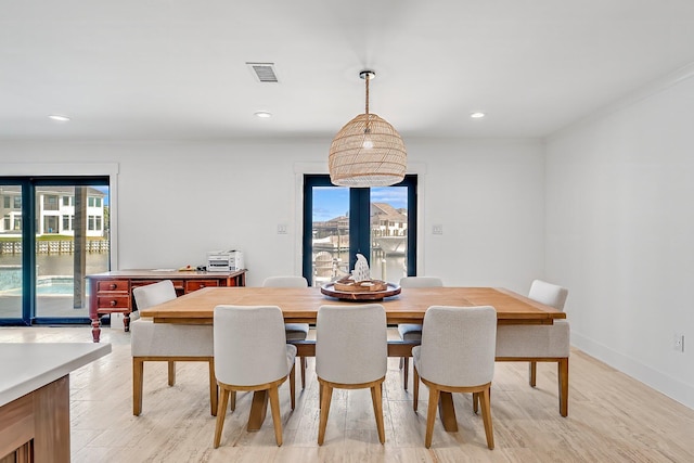 dining space featuring light hardwood / wood-style flooring and a wealth of natural light