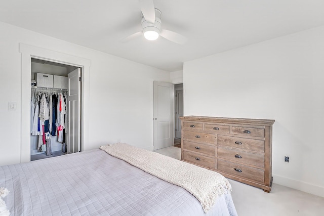 bedroom featuring light carpet, a closet, and ceiling fan