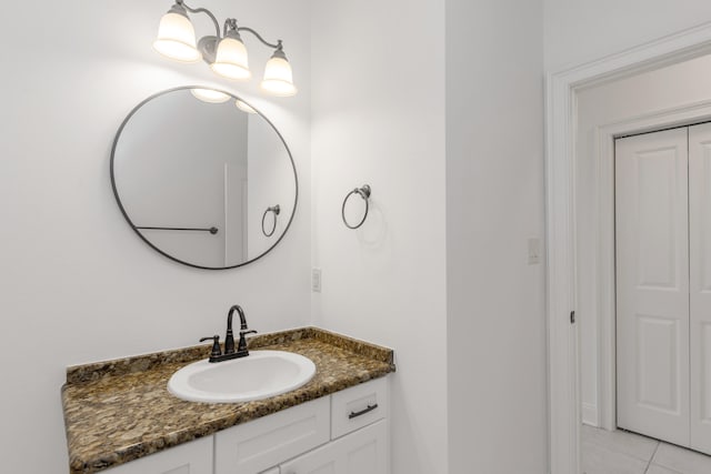 bathroom with tile patterned flooring and vanity