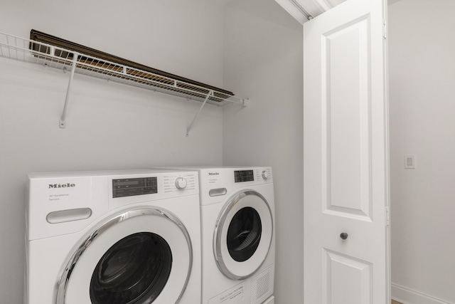 laundry area with washing machine and dryer