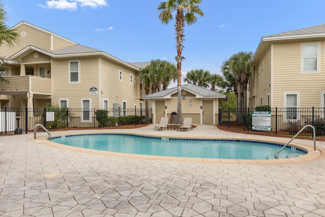 view of swimming pool with a patio